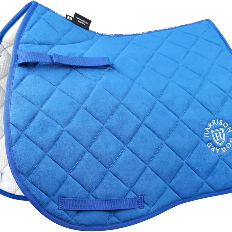 Blue horse saddle pad with quilted design and logo detail.