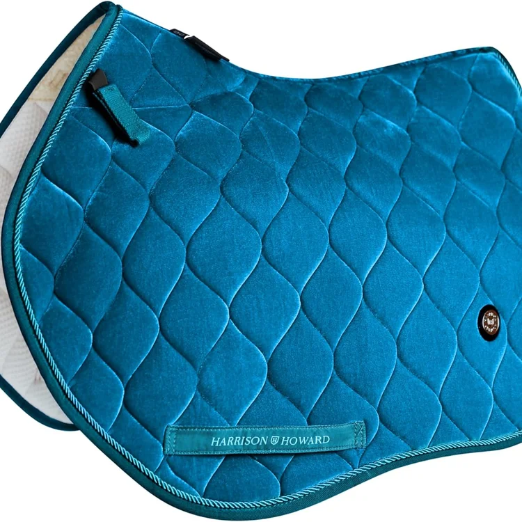 Teal horse saddle pad with quilted design and logo detail