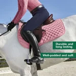 Well-padded pink horse saddle pad on a horse with rider in equestrian gear