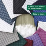 Horse saddle pads in various colors arranged on a wooden surface