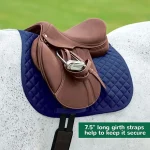 Brown horse saddle on a blue horse saddle pad with girth straps.