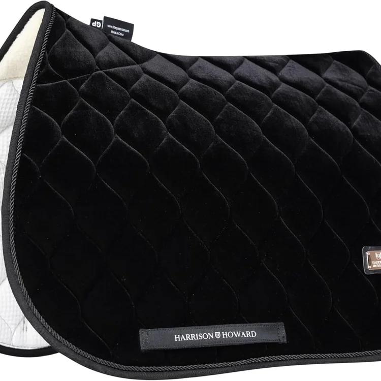 Black quilted horse saddle pad with soft lining and brand tag.