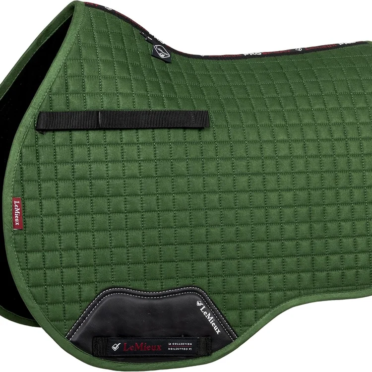 Green quilted horse saddle pad with black leather detailing and logo.