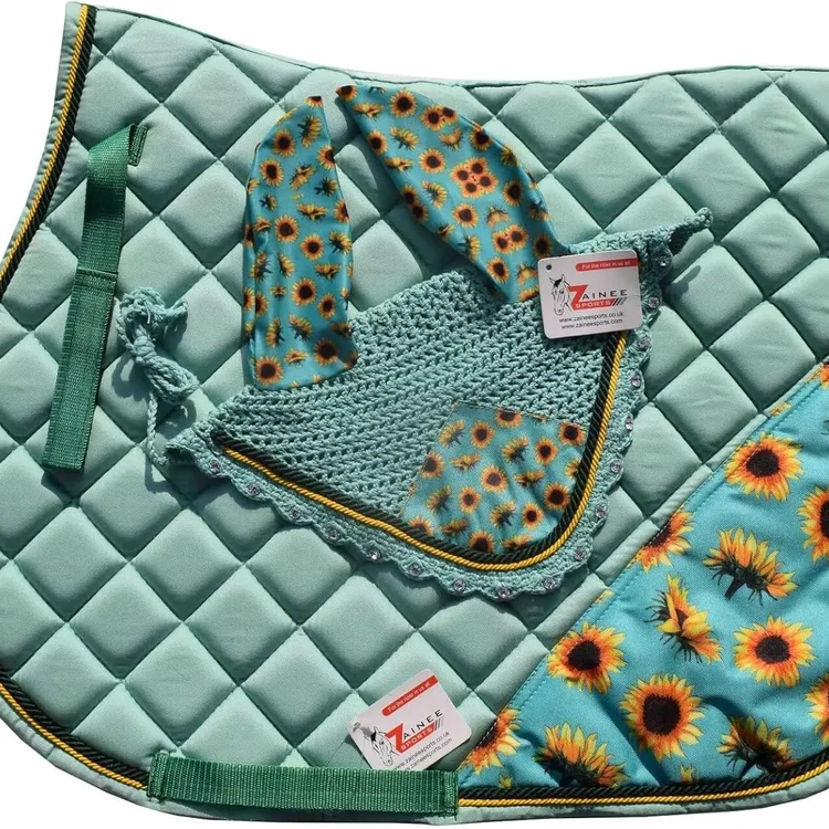 Turquoise horse saddle pad with sunflower pattern and matching ear bonnet