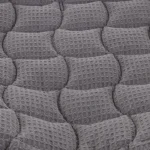 Gray textured fabric resembling a horse saddle pad surface.